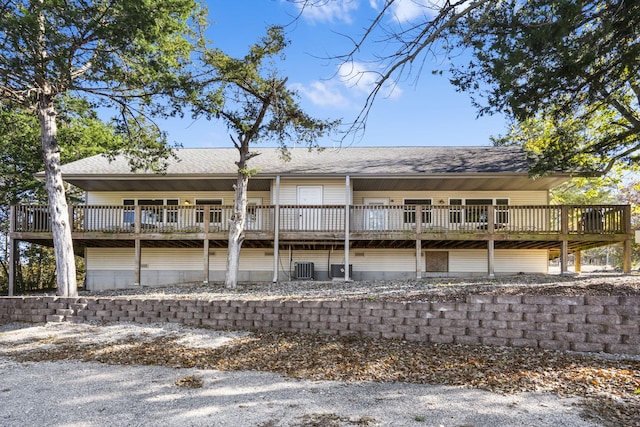 back of house with a wooden deck