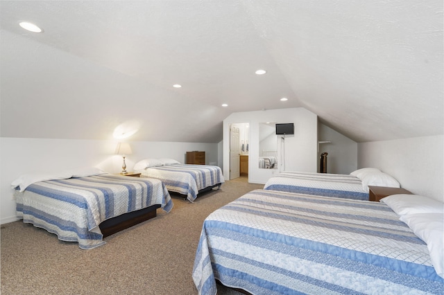 bedroom with carpet flooring, a textured ceiling, and vaulted ceiling