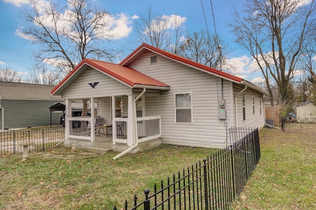 view of front facade with covered porch and a front yard