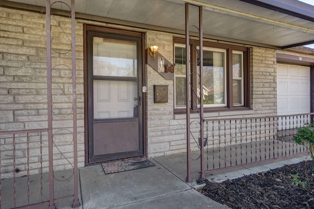 doorway to property featuring covered porch