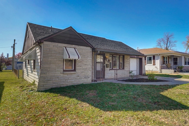 view of front facade featuring a front lawn, a porch, and a garage