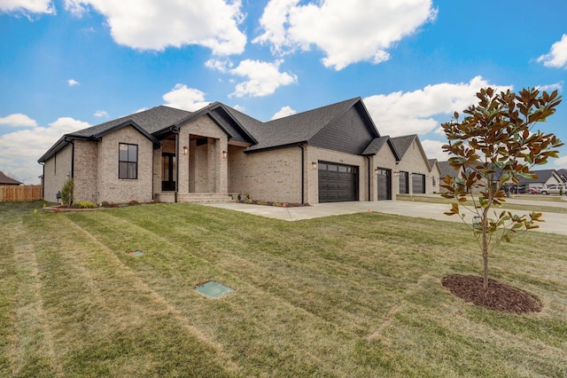 view of front of house featuring a front yard and a garage