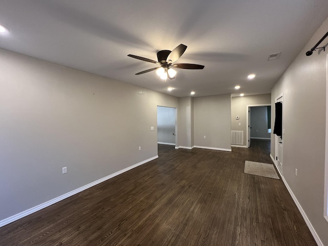 unfurnished room featuring dark hardwood / wood-style floors and ceiling fan