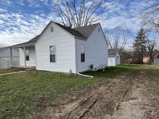 view of property exterior with a yard