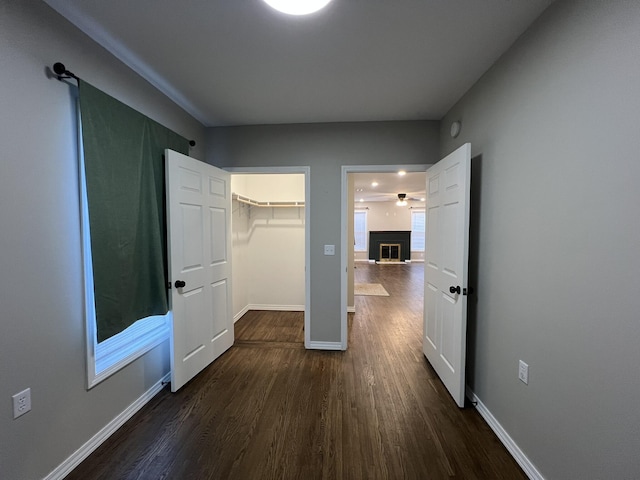 corridor featuring dark hardwood / wood-style flooring