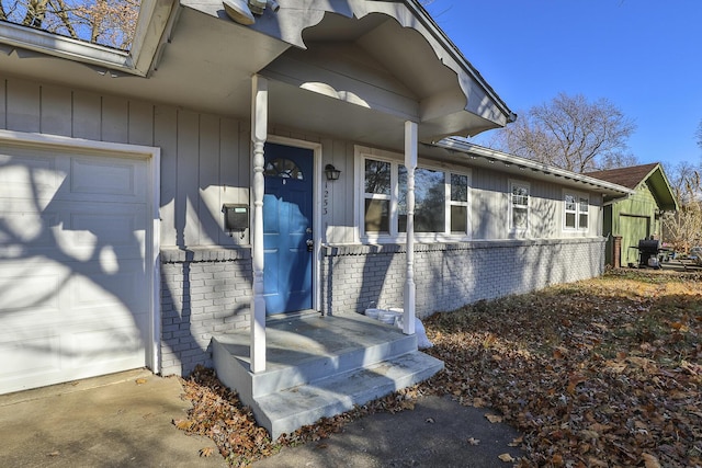 view of exterior entry with a garage