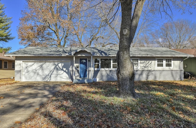 ranch-style home featuring a garage