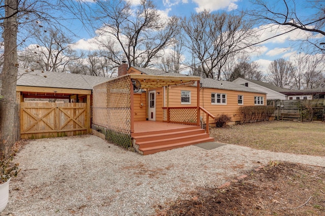 view of front of home featuring a wooden deck