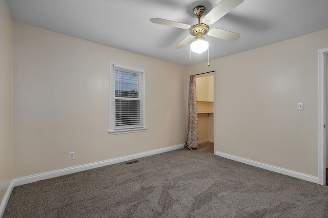 unfurnished room with carpet flooring and ceiling fan