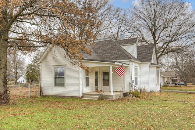 bungalow-style home with a front lawn