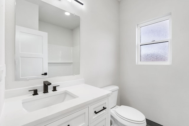 bathroom with vanity and toilet