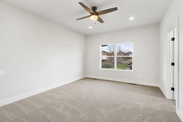 spare room with ceiling fan and carpet floors