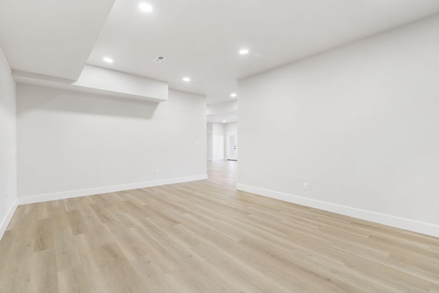 spare room with light hardwood / wood-style flooring