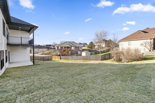 view of yard with a balcony