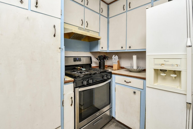 kitchen with stainless steel range with gas cooktop and white fridge with ice dispenser