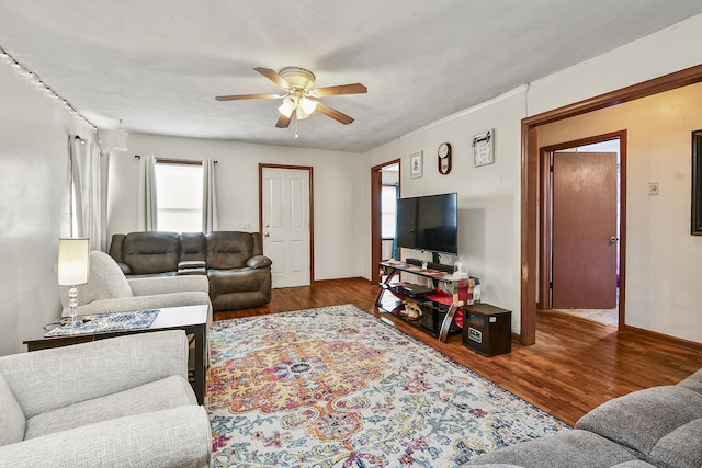 living room with hardwood / wood-style flooring, a wealth of natural light, and ceiling fan