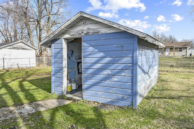 view of outdoor structure featuring a lawn