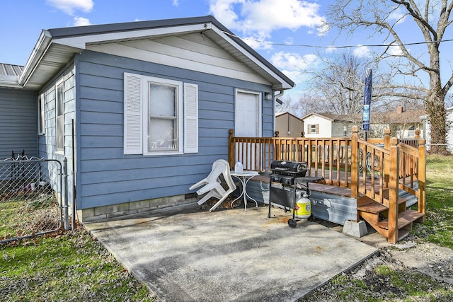 exterior space featuring a patio and a wooden deck