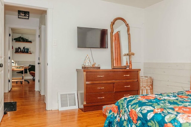 bedroom with light hardwood / wood-style floors