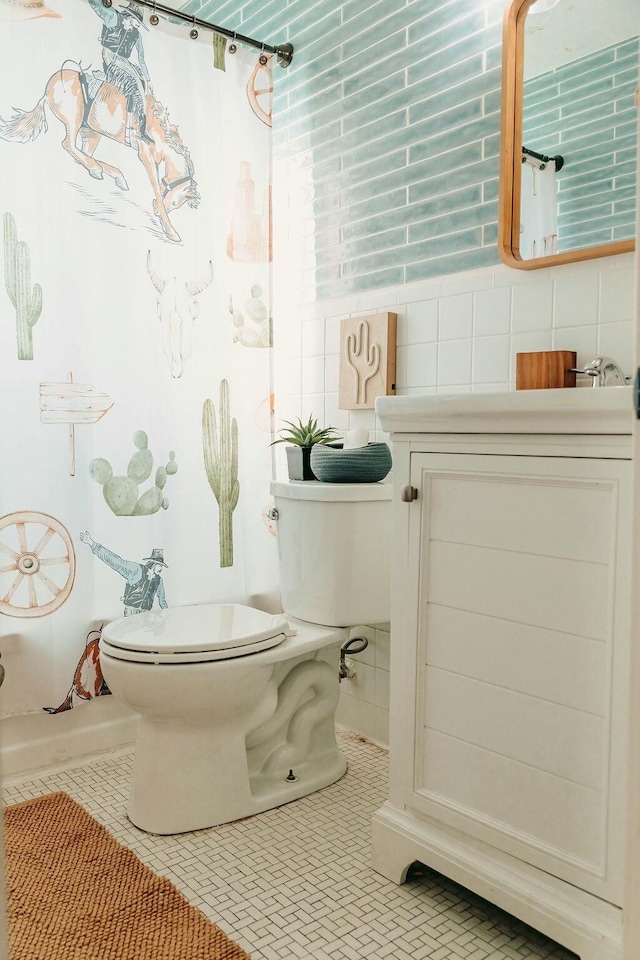 bathroom featuring tile patterned flooring, toilet, tile walls, and shower / tub combo