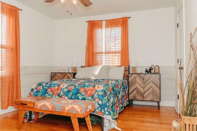 bedroom featuring ceiling fan and light hardwood / wood-style floors