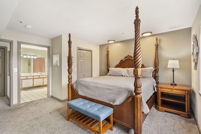 carpeted bedroom featuring connected bathroom and a closet