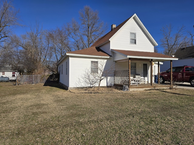 view of front of home with a porch and a front lawn