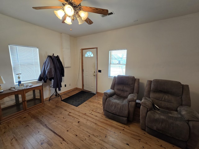 interior space with ceiling fan and light hardwood / wood-style floors