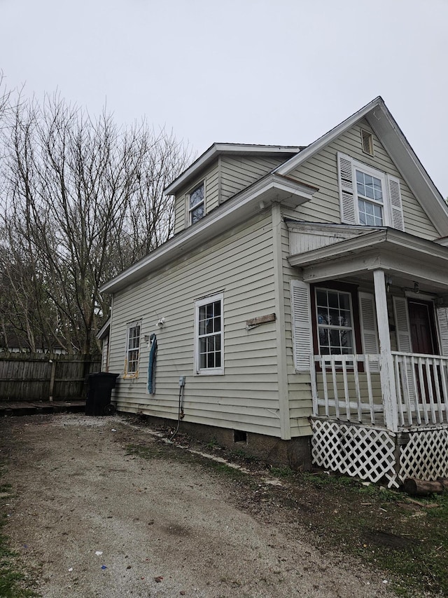 view of side of home featuring a porch