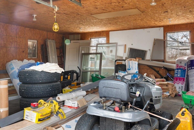 garage featuring wooden walls