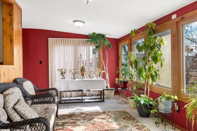 sunroom featuring vaulted ceiling