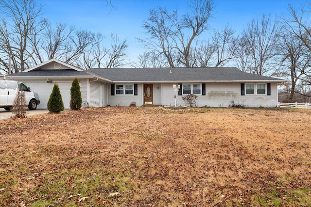 single story home featuring a garage