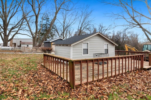 back of house featuring a deck