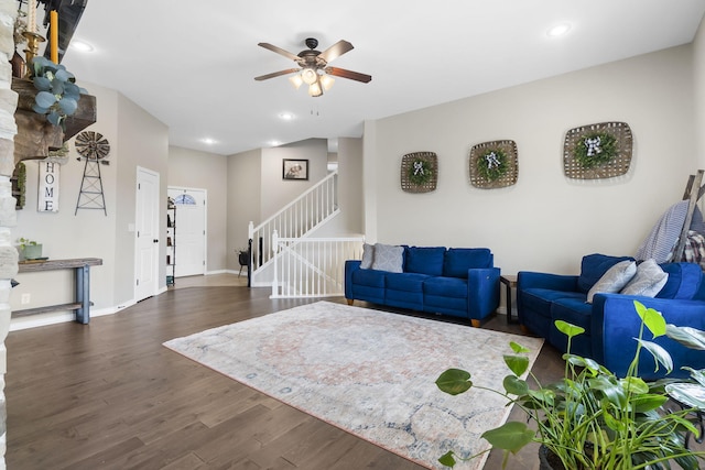 living room featuring dark hardwood / wood-style floors and ceiling fan