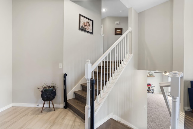 staircase featuring hardwood / wood-style flooring