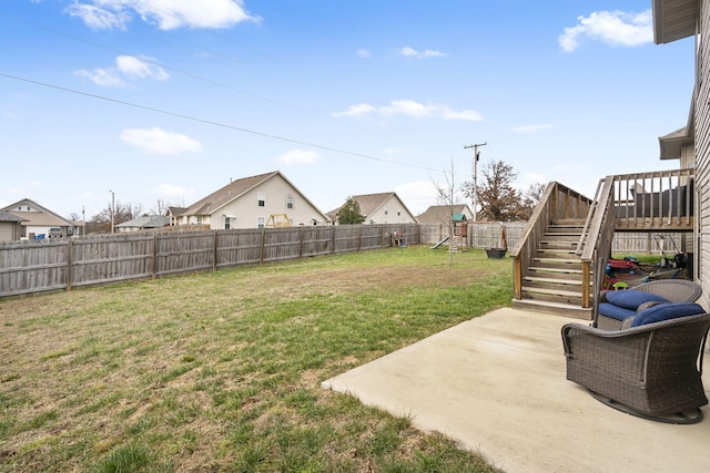 view of yard featuring a playground and a patio area