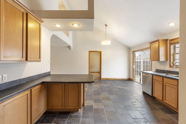 kitchen featuring kitchen peninsula, vaulted ceiling, sink, decorative light fixtures, and dishwasher