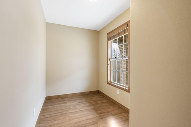 unfurnished room with light wood-type flooring