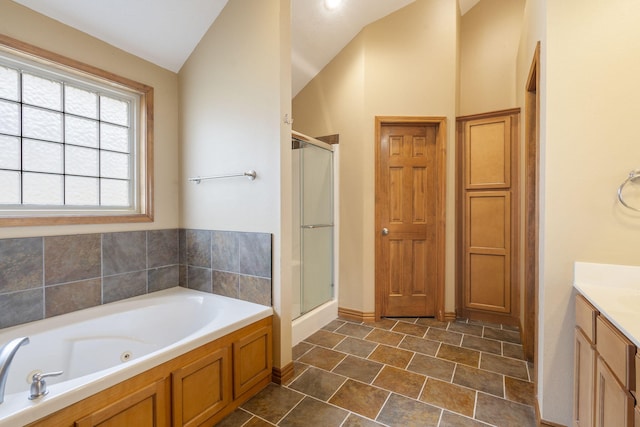 bathroom with vanity, plus walk in shower, and vaulted ceiling