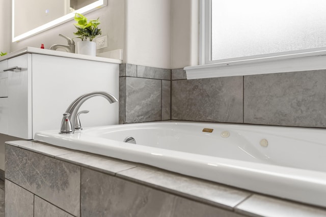 bathroom with tiled bath