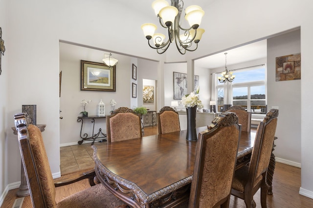 dining space with a notable chandelier