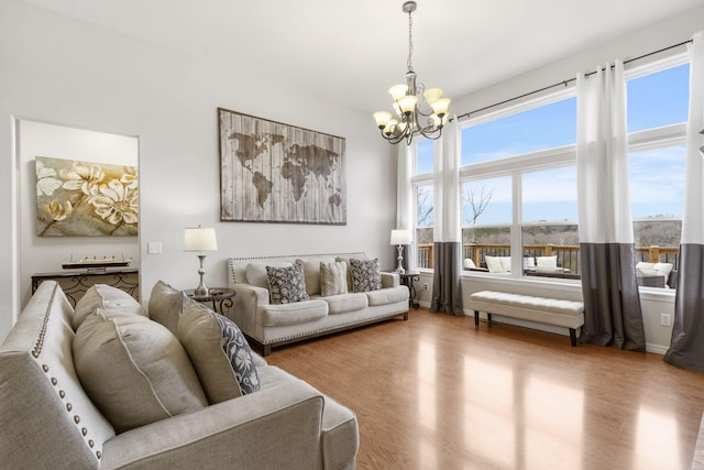 living room featuring a chandelier and hardwood / wood-style floors