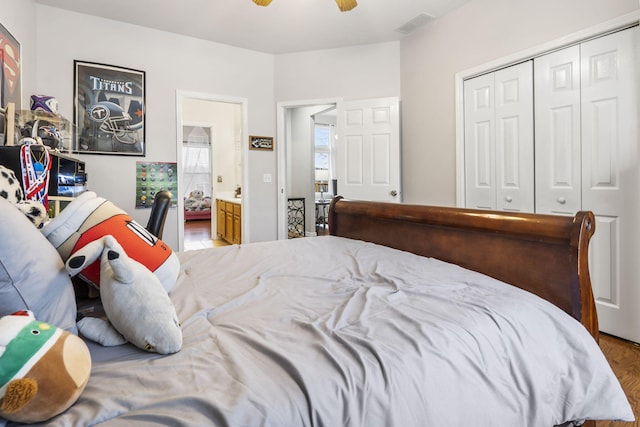 bedroom featuring hardwood / wood-style flooring, ceiling fan, and a closet