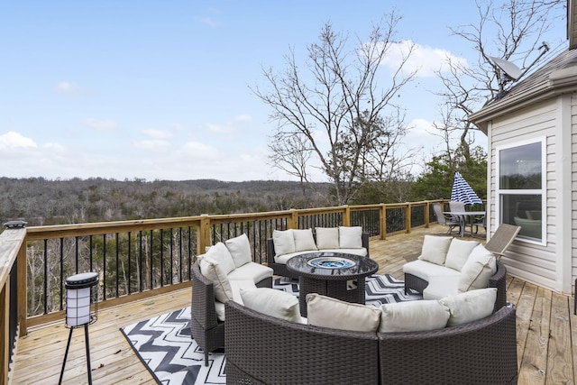 wooden terrace featuring an outdoor living space