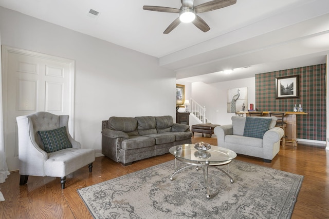 living room with ceiling fan and dark hardwood / wood-style floors