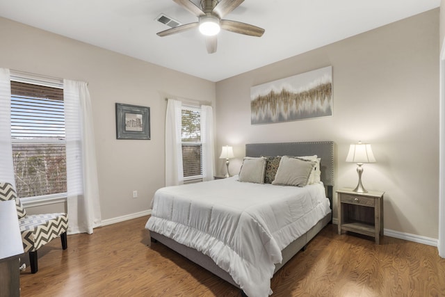 bedroom with ceiling fan and wood-type flooring