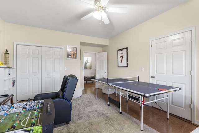 game room with ceiling fan and light hardwood / wood-style flooring