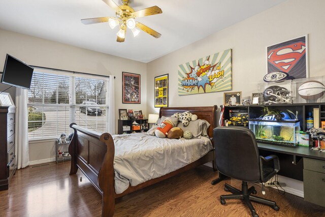 bedroom with hardwood / wood-style flooring and ceiling fan