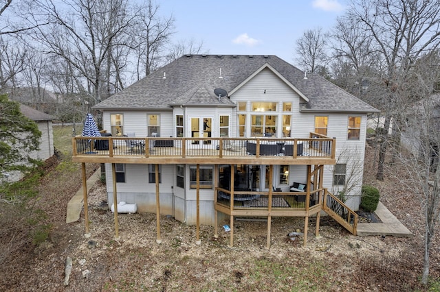 back of house with a deck and french doors