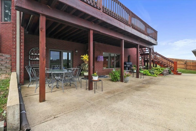 view of patio / terrace featuring grilling area and a wooden deck